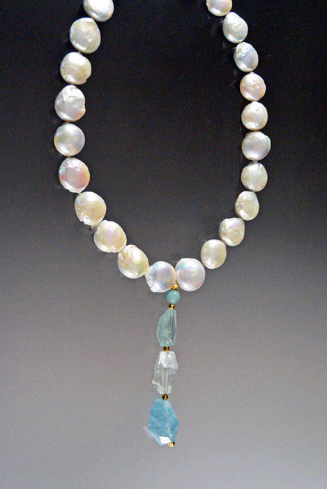 This magnificent showstopper features HUGE Grade AAA opulent 16mm white puffy coin pearls, a 14K toggle clasp and an amazing dangle with three different Grade AAA faceted Brazilian aquamarine stones (54 grams) . Necklace 19"  Dangle 3-1/2"  