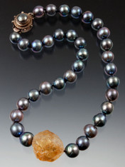 Totally spectacular!! Huge 16mm natural gray/mauve south sea pearls frame a rich golden orange Brazilian hammered citrine center. Hand-knotted with double Japanese-style silk knots.  Custom mabe pearl sterling clasp. 18"