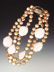 A bold statement for any occasion -- large faceted deep pink-rose Brazilian opal slices float on a sea of small gold coin pearl strands with a Peruvian mabe pearl custom clasp that can be a side or center station.  20"
