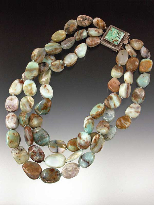 Three strands of subtly shaded Peruvian opal with choice of clasp.