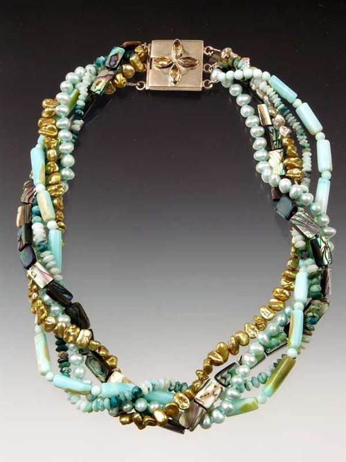 Feel like a mermaid in this medley of  blue/green tones featuring hemimorphite, abalone, peruvian opal, freshwater pearls - each one unique. Clasp varies with design but all very special. 21"