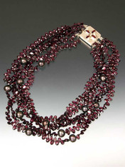 Take center stage with a magnificent multi-strand sparkler of grade AAA faceted rhodolite garnets starring 12mm freshwater pearls, finished off with a custom sterling garnet clasp.  Available in 5 or 6 strands 20" Similar design sold in high end Madison Avenue Boutique for $30,000 (with gold clasp)