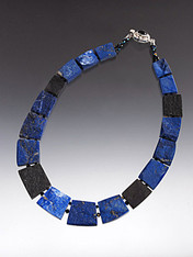 A rare and unusual fitted collar of the finest quality Grade AAA lapis and onyx slices - You get two looks in one -- Rough and smooth!   One side is raw showing all the amazing natural patterns - the other highly polished with stunning deep cobalt blue and black.  18"