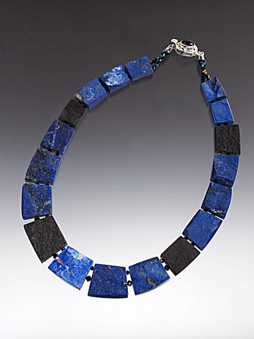 A rare and unusual fitted collar of the finest quality Grade AAA lapis and onyx slices - You get two looks in one -- Rough and smooth!   One side is raw showing all the amazing natural patterns - the other highly polished with stunning deep cobalt blue and black.  18"