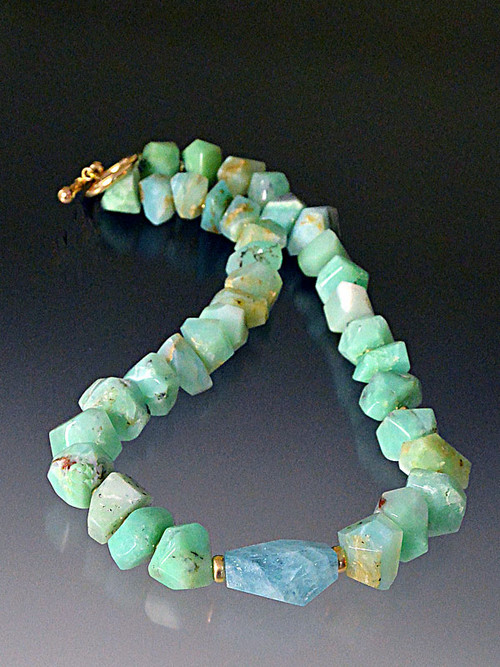 Brilliant grade AA cut Peruvian opals with natural variations, a faceted Brazilian aquamarine center stone, 14K rondels and clasp  18"