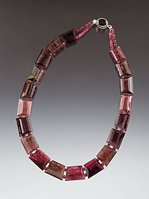 A spectacular collar of grade AA trillion cut perfectly matched pieces of Brazilian watermelon tourmaline in dazzling shades of pinks, rubies and green