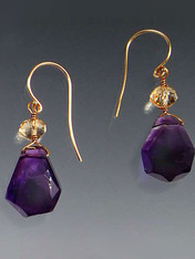 Great quality and so versatile. Deep purple amethyst drops crowned with faceted citrine rondels gracefully suspended on 14K earwires. 1"