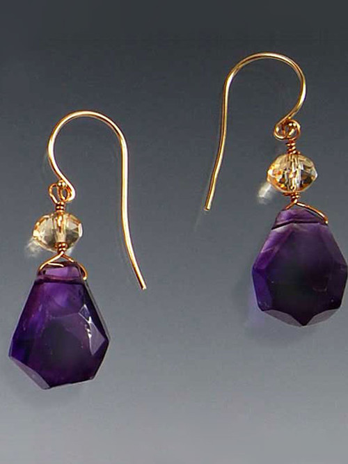 Great quality and so versatile. Deep purple amethyst drops crowned with faceted citrine rondels gracefully suspended on 14K earwires. 1"