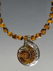 Make a statement with this faceted Tiger Eye necklace and ammonite pendant set infiligree sterling silver 19"