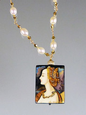 This hand-painted Russian lacquered miniature features a portrait of the beautiful Lucretzia Borgia in profile.The menacing serpent twisted around her gold necklace symbolizes her poisonous cunning. 