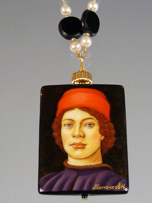 This is definitely my favorite!  This hand-painted Russian lacquered miniature features a Botticelli portrait of a young courtier with a red hat.  The black onyx pendant (1-3/4" x 3/4") has been painstakingly covered with many layers of oil paint, egg tempura, gold foil, and lacquer to create the dramatic effect.  The pendant, crowned with a 14K gold rondel and 24K Swarovski crystal, hangs from a gold wire wrapped chain of white freshwater pearls and jet discs.  28" 
 