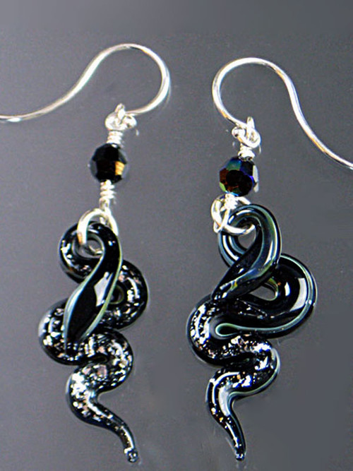 These sparkling dramatic earrings feature silver and black Venetian glass serpents, Swarovski crystals and sterling silver earwires. 
