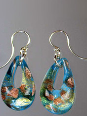 These teardrop earrings feature authentic Murano Glass with a base of Celeste Aqua glass with Gold Foil and aventurina then encased in clear glass with flecks of gold and silver. They are rich in color, each one slightly different as they are entirely handmade. The mound of clear Murano Glass over the color give sit a magnified effect. Sterling Silver Earwires. 1-1/2" 