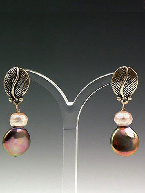 These striking earrings feature a mocha coin pearl, a pale pink pearl rondel, and a sterling silver leaf with post. 1"
 