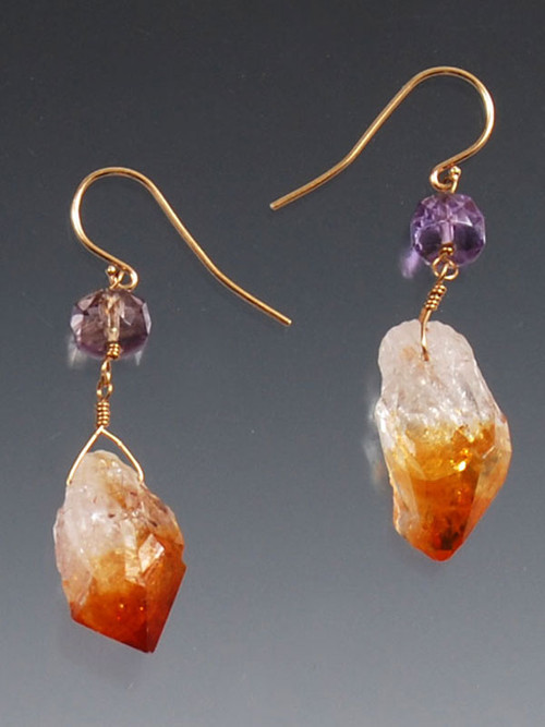 These earrings give a global earthy vibe and feature freeform raw citrine drops topped with faceted ametrine rondels dangling gracefully from 14K earwires.  No two exactly alike. 1"