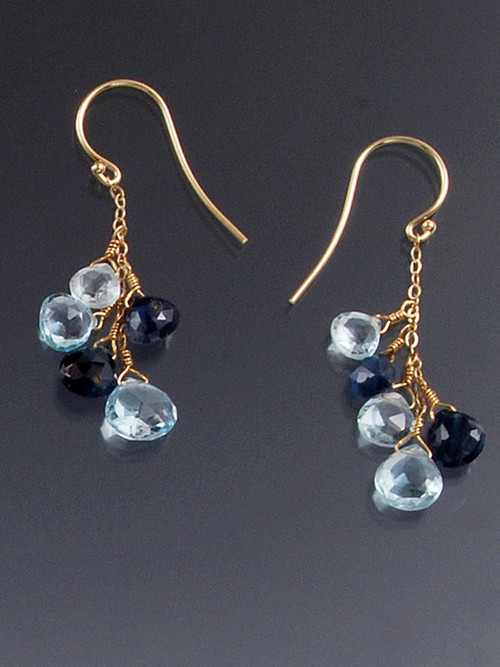 These earrings feature totally luxurious Grade AAA rich blue satin faceted Sapphires alternating with pale blue topaz dangling on a 14K chain and earwire. 1-1/2"