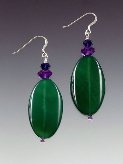 These earrings will go with all the new colors and brighten your look at the same time. Vivid green agate slices topped with amethyst and deep indigo Swarovski rondels and a sterling silver earwire. 1-3/4"
 