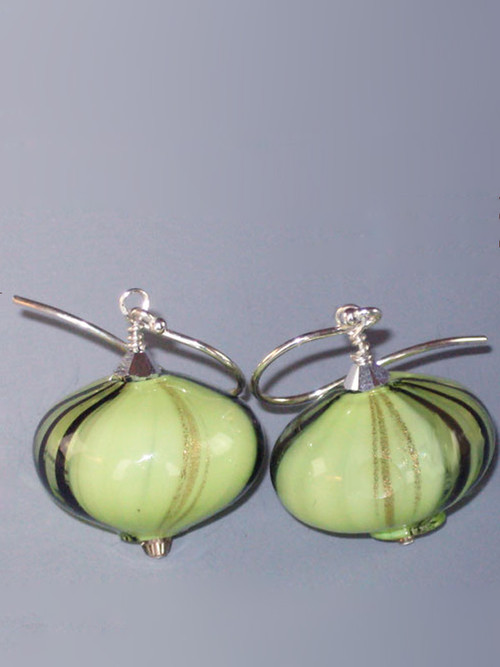 These dramatic earrings feature peridot , gold and black window hand=blown Sasso Swirl beads topped with a Swaorvski sterling diamond and sterling earwires.  A perfect match to the Peridot Veneitian Windows Necklace.  Choose silver or gold earwires.