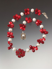This opulent necklace has a vintage French crystal flower suspended on a strand of coral, crystal and luxurious white pearls. 18"