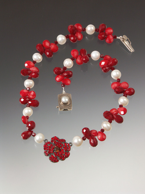 This opulent necklace has a vintage French crystal flower suspended on a strand of coral, crystal and luxurious white pearls. 18"