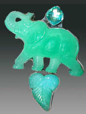 This Amy Kahn Russell pin / pendant features a bright green hand-carved chrysophrase elephant! 