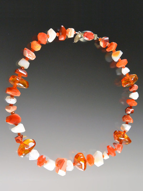 Capture the glow of spring and summer with this lustrous collar featuring alternating Grade AAA faceted fire agate, white opal, and natural Baltic amber with a custom sterling spiny oyster clasp. 18"
