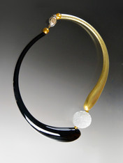 If you like asymmetrical modern designs, this is for you! This brand new Venetian Glass Bead is extremely popular in contemporary designs in Venice and San Marco. Our dramatic asymmetrical collar features two curved blown Venetian "boro" glass hollow tubes- one black, the other topaz with 24K gold, four 24K Venetian gold small beads, a bright white Brazilian Druzy disc, and a limited edition vintage sterling floral dome brass clasp. 22"