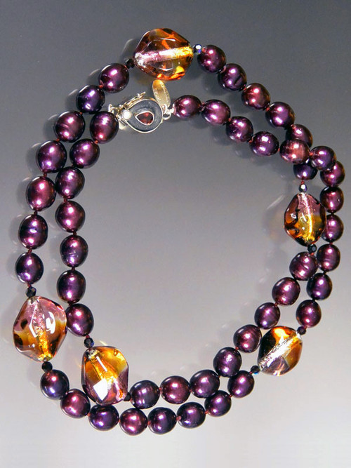 This spectacular long necklace features deep wine pearls, imited edition tri-color transparent amber, amethyst, purple, sterling silver Venetian three dimension sasso* beads, garnet Swarovski crystals and a custom garnet sterling clasp so you can wear it long or double.  Easy to pair with other pieces in the collection.  Super elegant and perfect tones for right now.  32"  ONLY TWO!
