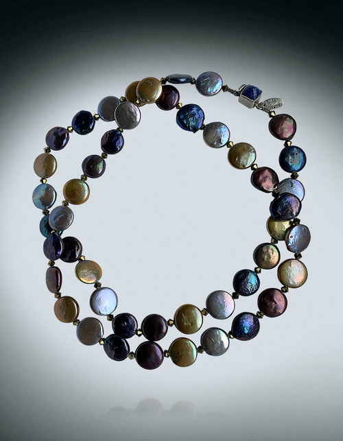 With alternating 14mm coin pearls in navy, golden brown, silver, iridescent green and sparkling Swarovski crystals you can wear this versatile necklace as a rope or double around your neck thanks to a small lapis clasp