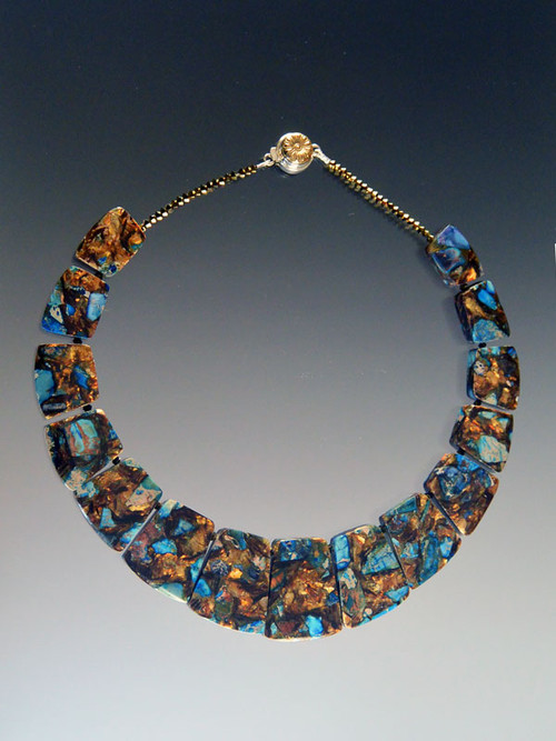 This collar of intricately patterned copper blue sea-sediment jasper with flashes of sky blue,copper, and brown, complements your fall wardrobe and fits your neck to perfection. No two identical but all equally beautiful.18" 