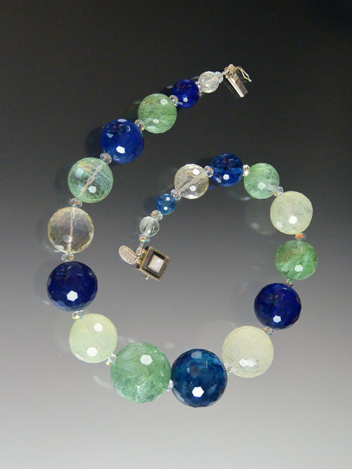 Make a dramatic statement! This luminous collar of graduated faceted gumball quartz globes in cobalt, celadon and clear crystal is the fall version of our pastel gumball necklace. 18"

 