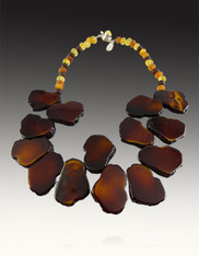 Incredibly vivid "resin" freeform tortoise shell finished with natural amber and an amber or garnet clasp is light as a feather but makes a BIG statement on any outfit.  Perfect for today's  "dimensional" look at a perfectly affordable price.  19" ONLY ONE LEFT!