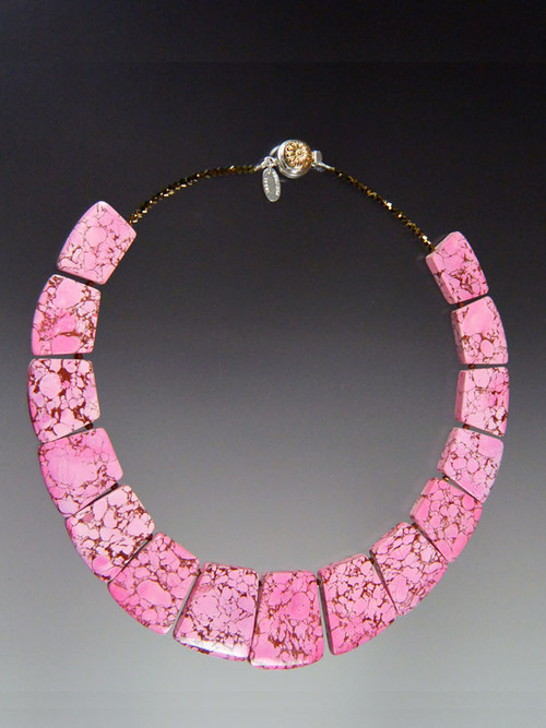 This bright howlite geometric collar features intricately patterned pink that will blend will all your spring summer ensembles. 18"