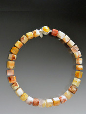 This one-of-a-kind ethically sourced Brazilian step cut quartz necklace is a medley of butterscotch, terracotta and peach tones with a vintage bakelite clasp.