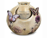 Porcelain recirculating, plug-in Butterfly fountain with Pump and pebbles Included.