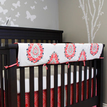 Crib rail protector in coral