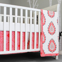 Coral and white crib blanket, sheet, and dust ruffle