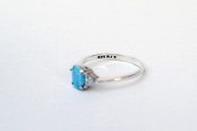 Here is a great Sterling Silver ring with a great center Opal stone with Triangle CZ's on each side- Size 9