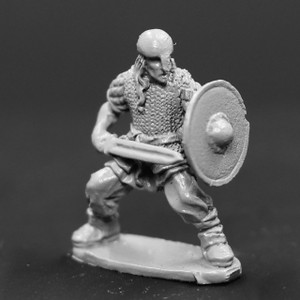 Viking Male armored in chainmail defending with sword and shield