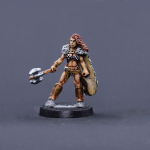 Northern barbarian female in wolf pelt cape with axe