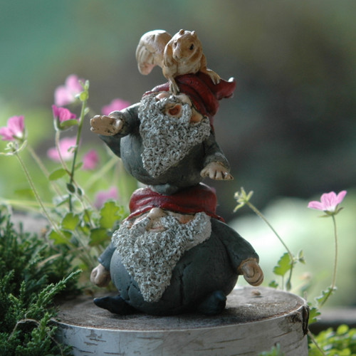 Stack of Miniature Garden Gnomes with Tiny Squirrel on Top