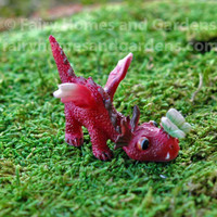 Miniature Baby Red Dragon with Tiny Green Butterfly on His Nose