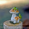 Tiny Frogs on Mushrooms
