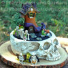 Skull Fairy Garden Container Filled with Halloween Decorations