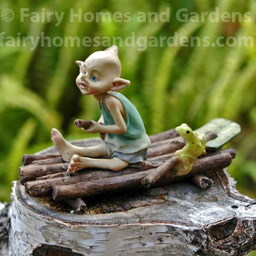 Miniature Pixie Rowing a Raft with Tiny Frog