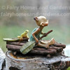 Miniature Pixie Rowing a Raft with Frog Side View