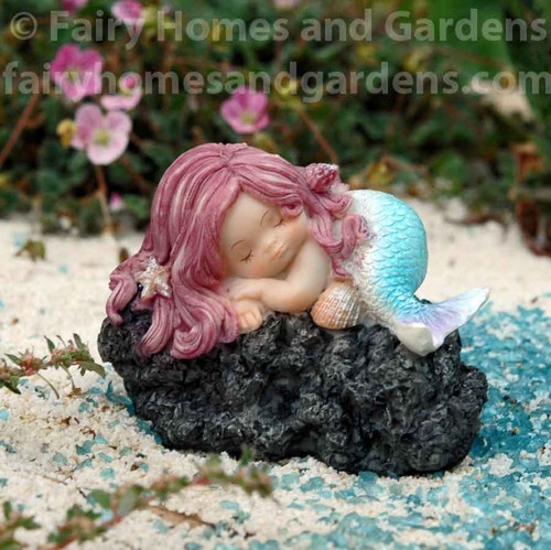 Sleeping Little Mermaid on Black Rock