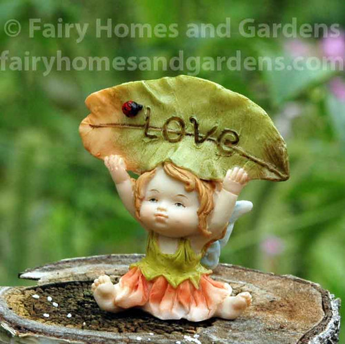 Little Fairy Caroline Holding a "Love" Sign