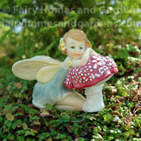 Miniature Top Collection Flower Fairy Resting on Mushroom 
