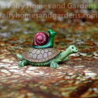 Miniature Snail Hitching a Ride With Turtle Figurine